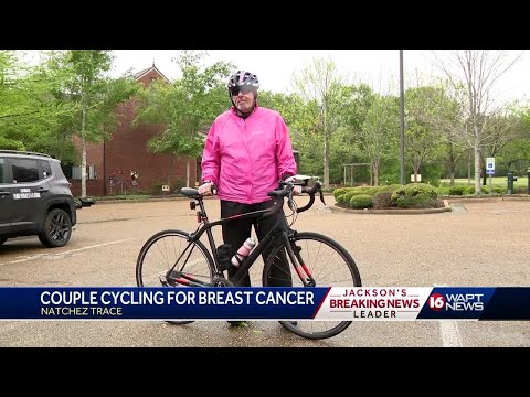 Couple cylcles for breast cancer awareness [Video]