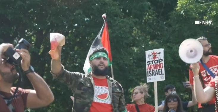 Anti-Israel agitator in Hamas headband holds up bloodied Biden face mask steps from White House [Video]